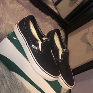 Size 8.0 women’s black and white slip on vans